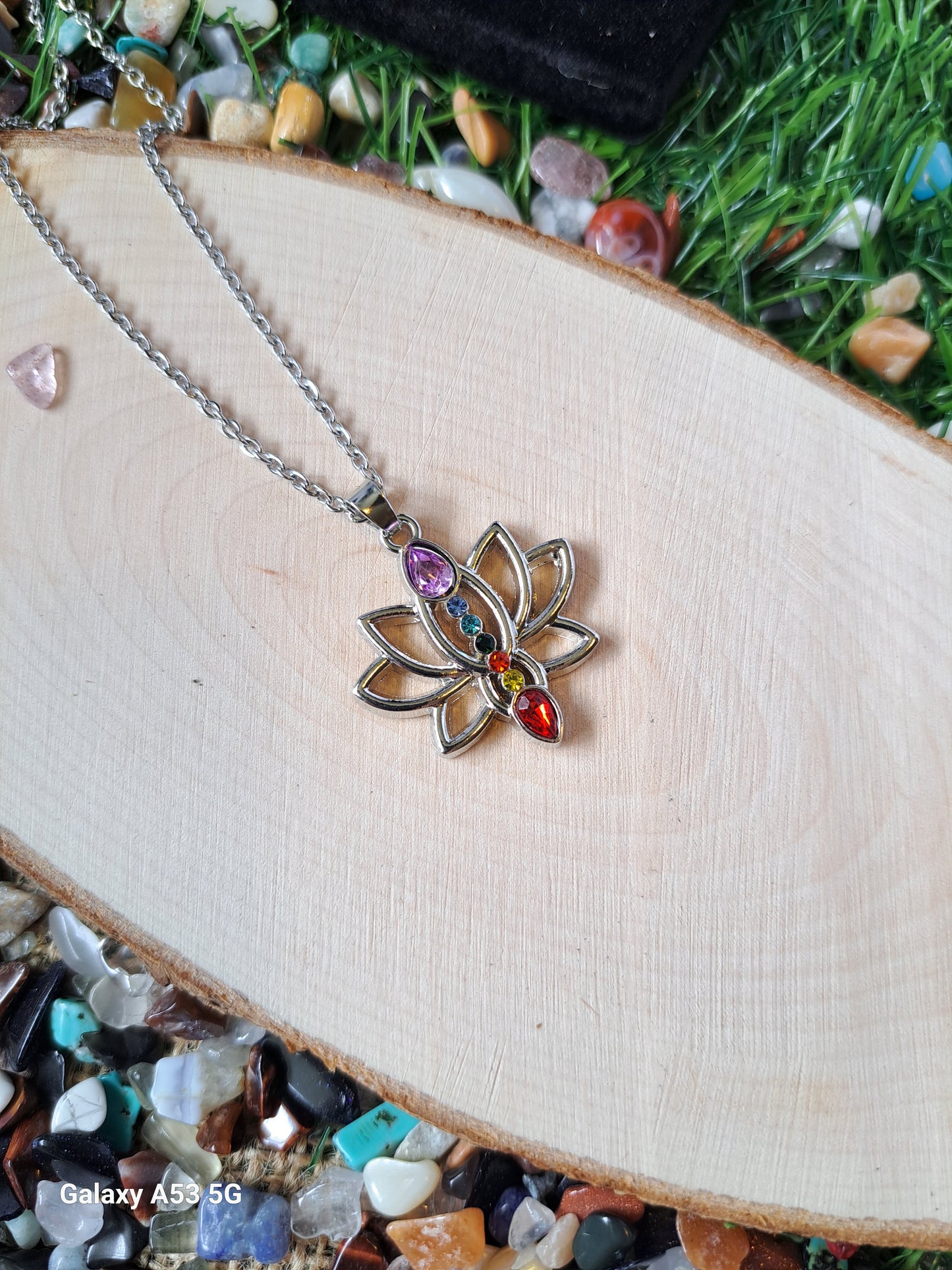 Chakra lotus pendant delicate necklace. The lotus flower pendant symbolizes purity, transformation, and spiritual enlightenment. Thus, this lotus chakra necklace can help you cleanse your aura from negative energy and encourage spiritual development.