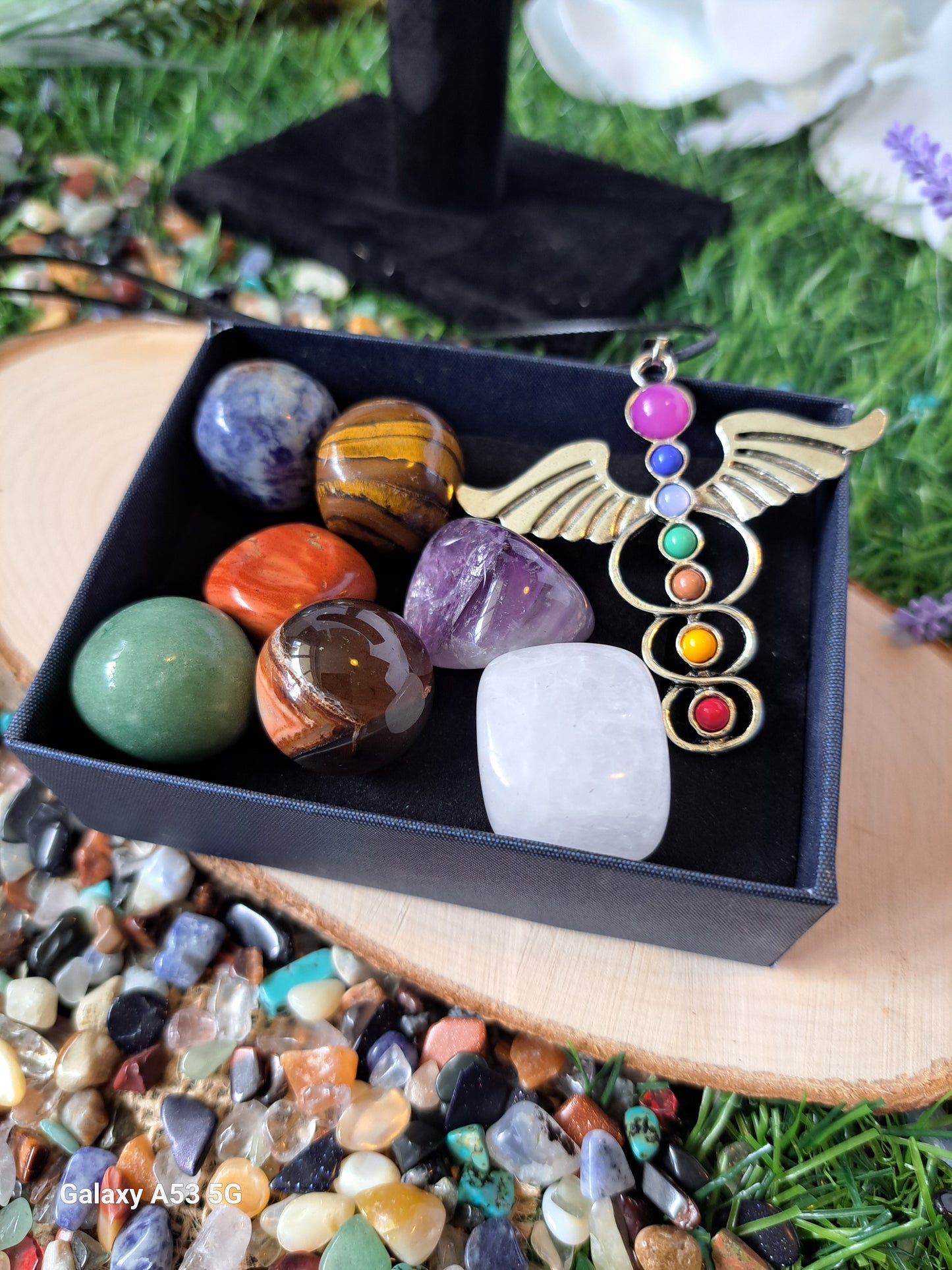 Chakra crystal sets include 7 chackra tumbling stones and a chakra medical symbol associated with healing, health and wisdom